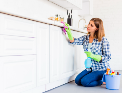 a house cleaner working on cabinets when cleaning a Monroe ct home